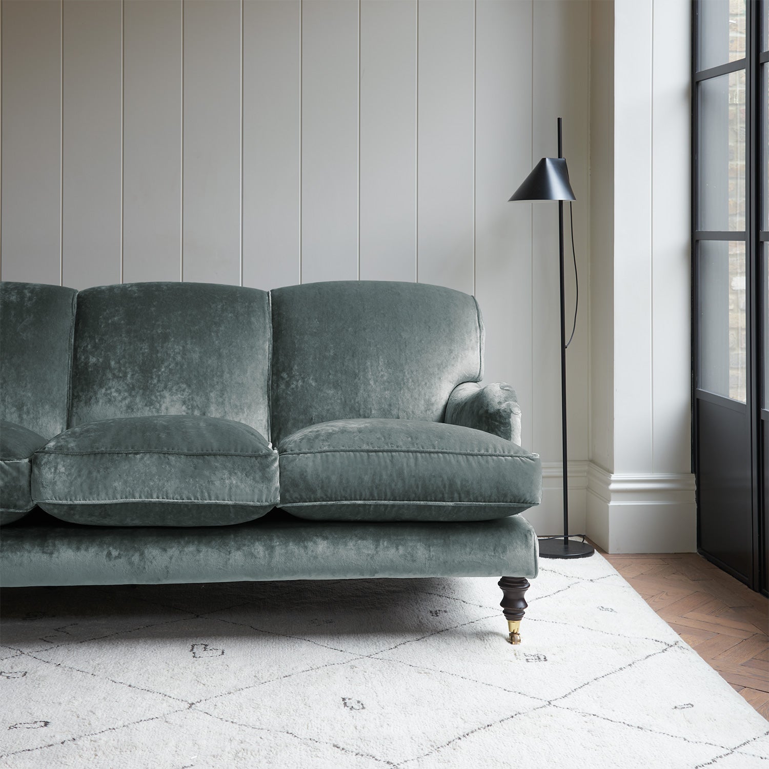 Velvet sofa in a blue crushed velvet upholstery fabric