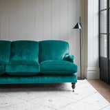 Velvet sofa in a teal crushed velvet upholstery fabric
