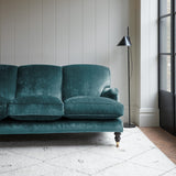 Velvet sofa in a dark blue crushed velvet upholstery fabric