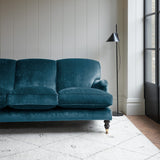 Velvet sofa in a dark blue crushed velvet upholstery fabric