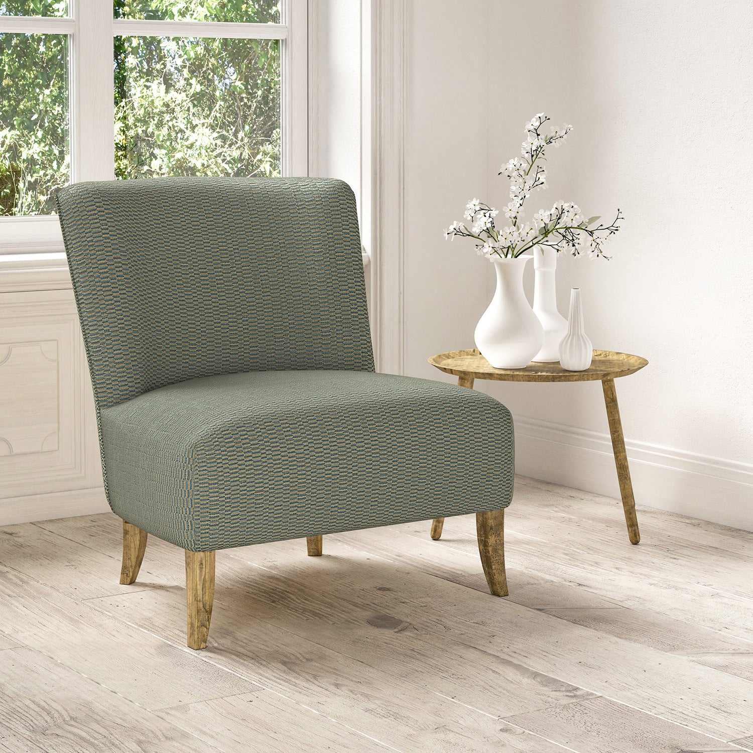 Chair upholstered in a stain resistant blue fabric with broken stripe design