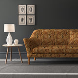 Velvet sofa upholstered in a brown velvet fabric with vintage kilim design and stain resistant finish
