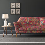 Velvet sofa upholstered in a pink and multicoloured velvet fabric with carpet design and stain resistant finish