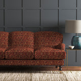 Velvet sofa upholstered in a stain resistant velvet fabric with a dark red kilim design