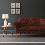 Velvet sofa upholstered in a stain resistant velvet fabric with a dark red kilim design
