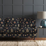 Velvet sofa upholstered in a dark, luxurious stain resistant velvet with whimsical design