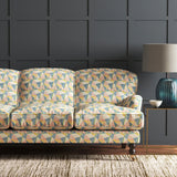 Velvet sofa upholstered in a pastel coloured velvet fabric with geometric design and stain resistant finish