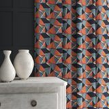 Velvet curtain in a blue and orange velvet fabric with modern geometric design