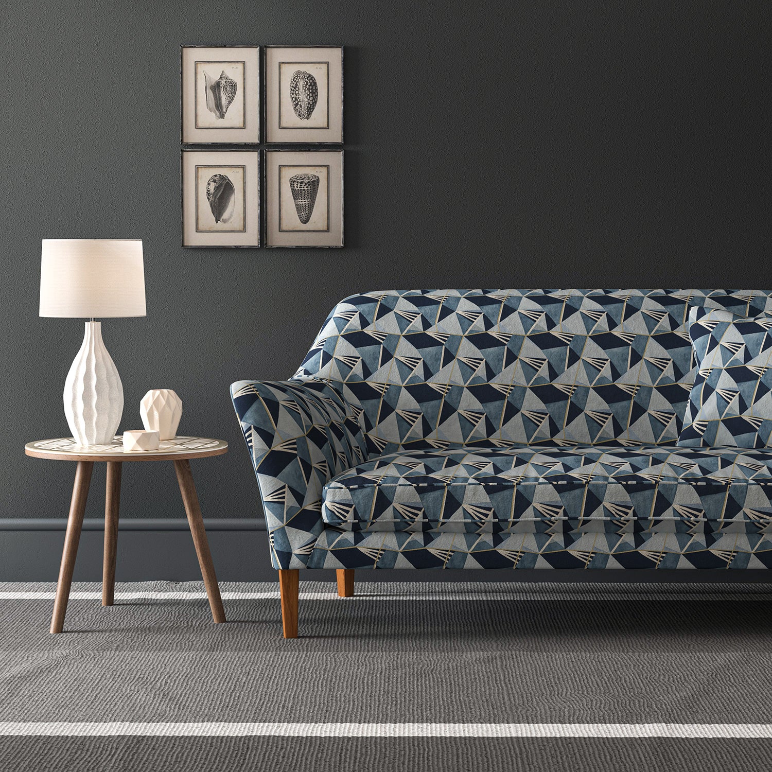 Velvet sofa upholstered in a blue velvet fabric with geometric design and stain resistant finish
