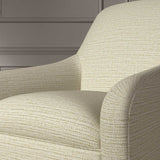 Close up of a chair covered in a woven fabric in a herringbone design in Pumice