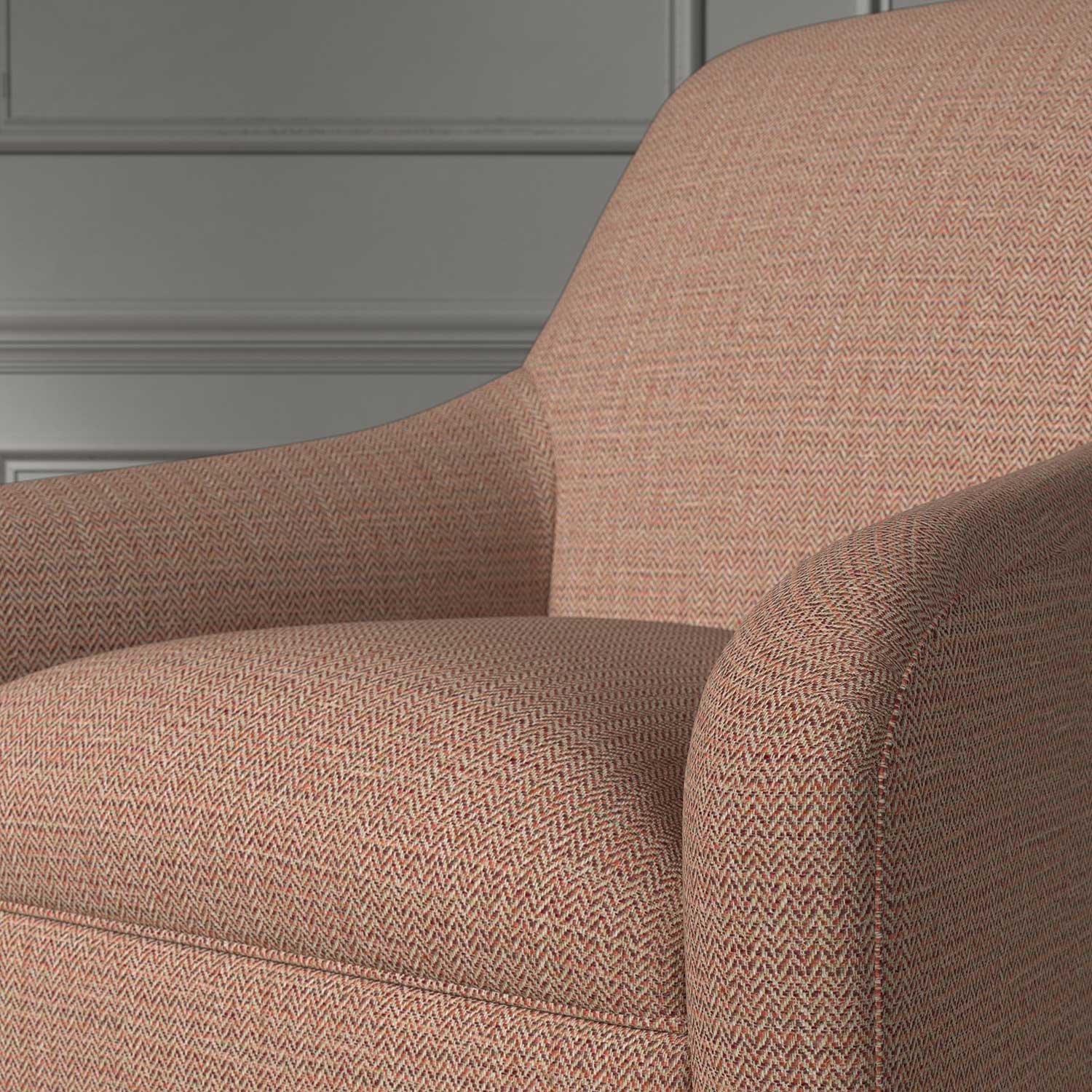 Close up of a chair covered in a woven fabric in a herringbone design in Ember