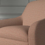 Close up of a chair covered in a woven fabric in a herringbone design in Ember