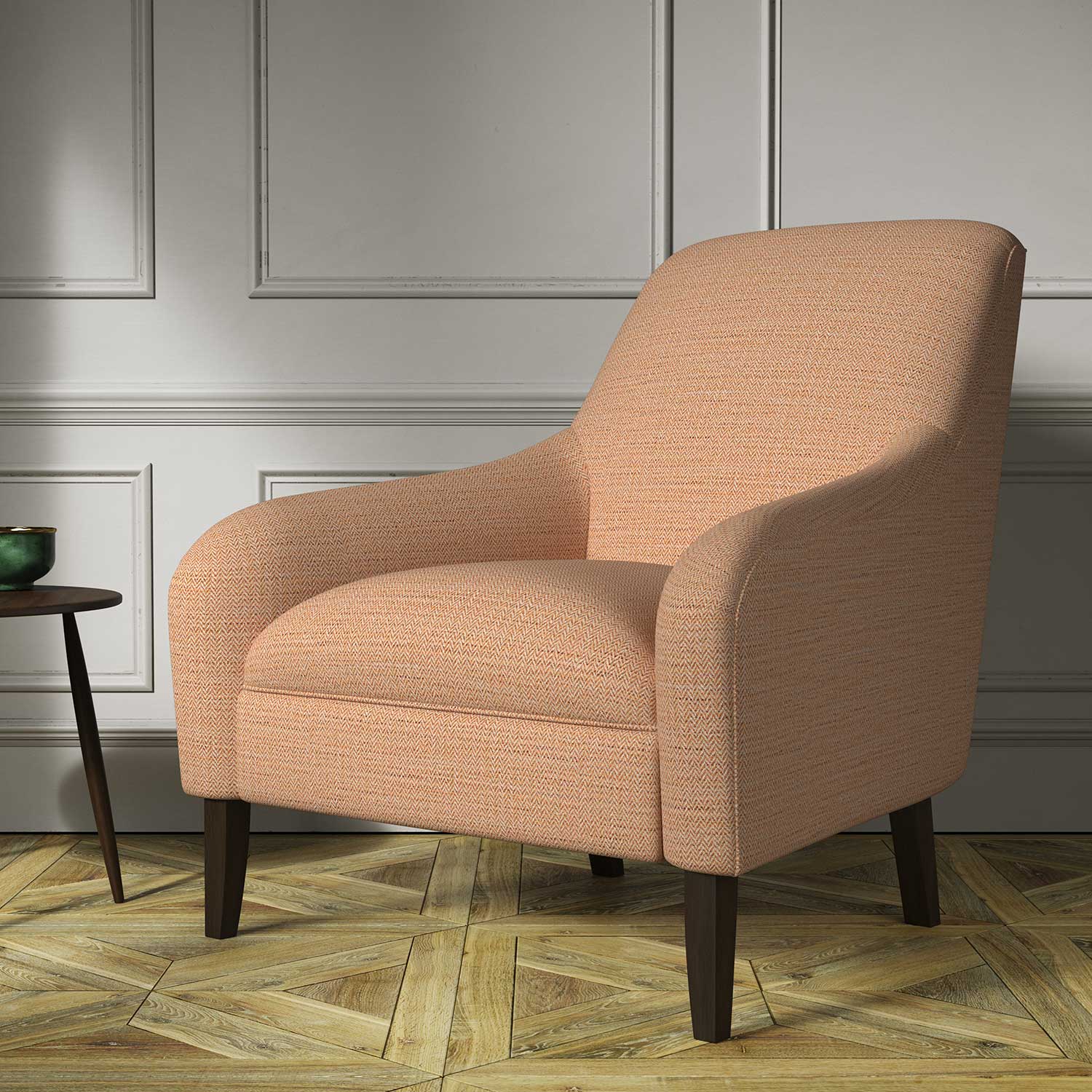 Chair covered in a woven fabric in a herringbone design in Amberlite 