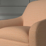Close up of a chair covered in a woven fabric in a herringbone design in Amberlite 