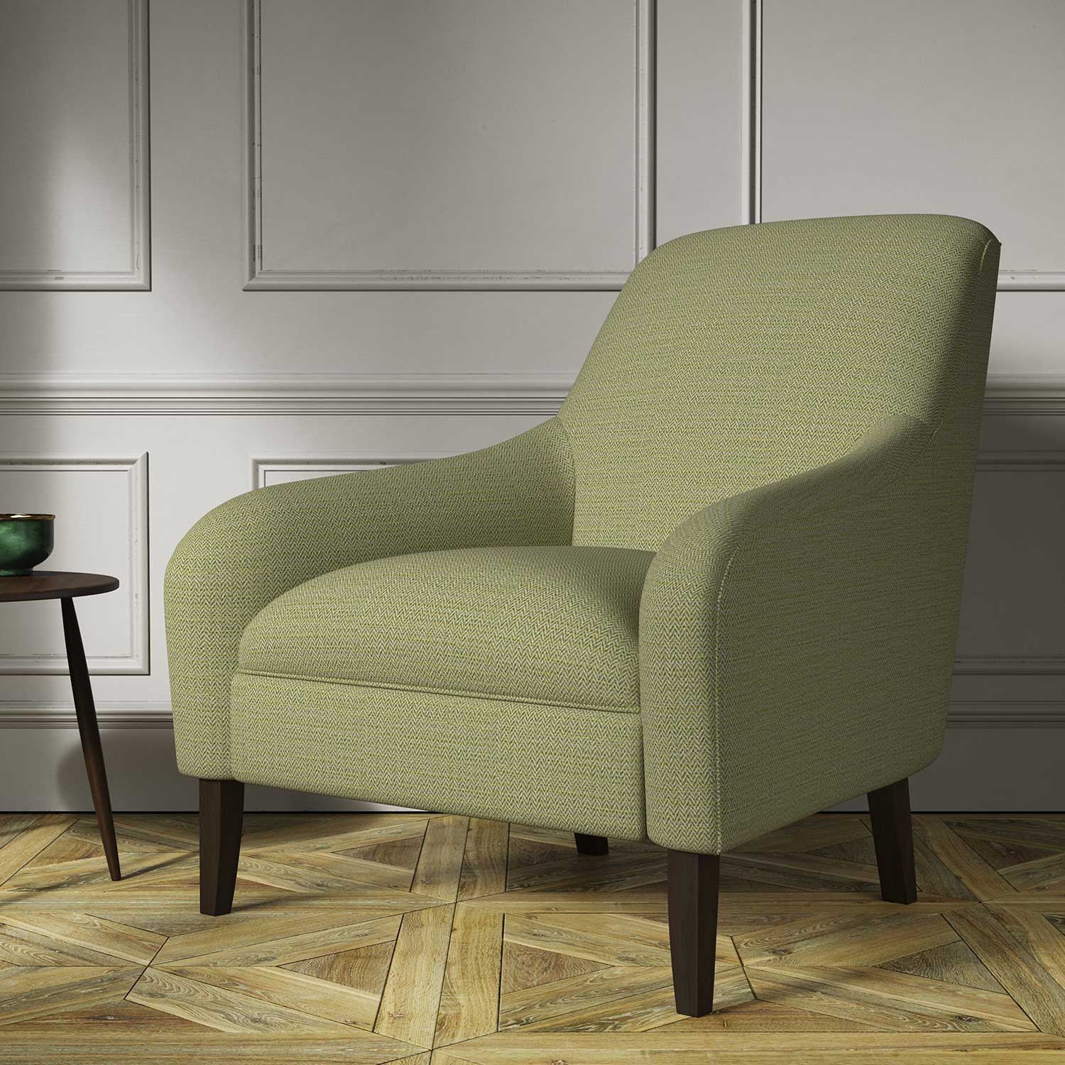Chair covered in a woven fabric in a herringbone design in Lime