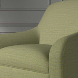 Close up of a chair covered in a woven fabric in a herringbone design in Citrine