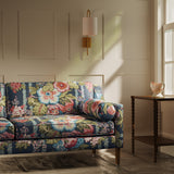 Sofa upholstered in a lively, large scale floral linen fabric
