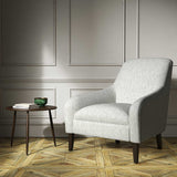 A white woven fabric on an armchair.