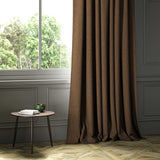 A brown woven fabric shown as a curtain.