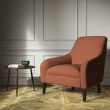 A orange woven fabric on an armchair.