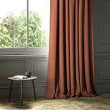 A orange woven fabric shown as a curtain.
