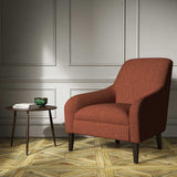 A orange woven fabric on an armchair.