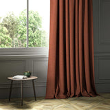 A orange woven fabric shown as a curtain.