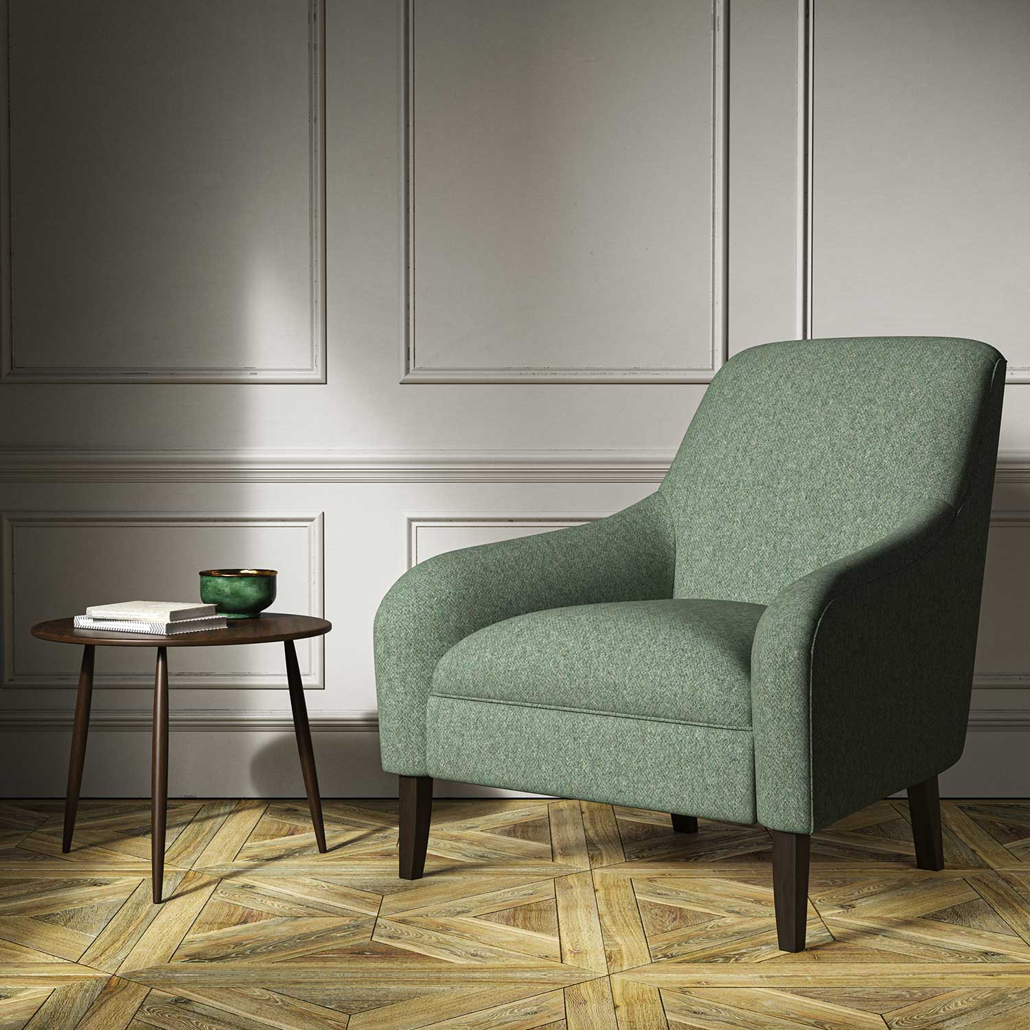 A green woven fabric on an armchair.