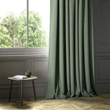 A green woven fabric shown as a curtain.