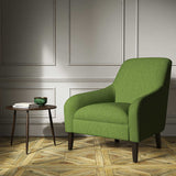 A green woven fabric on an armchair.