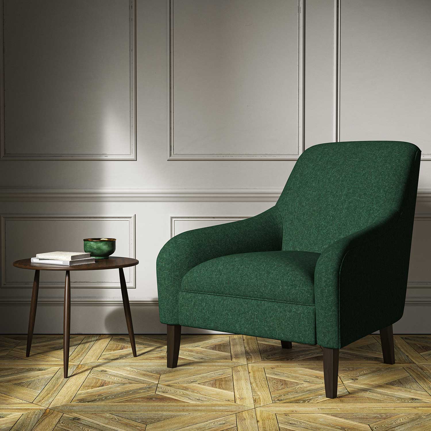 A green woven fabric on an armchair.