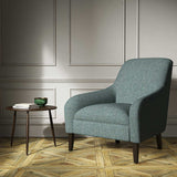 A blue woven fabric on an armchair.