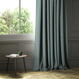 A blue woven fabric shown as a curtain.
