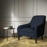 A blue woven fabric on an armchair.