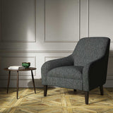 A grey woven fabric on an armchair.