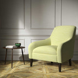 Armchair upholstered in a green woven fabric