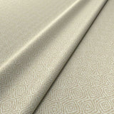 Fabric swatch of a cream woven fabric for upholstery