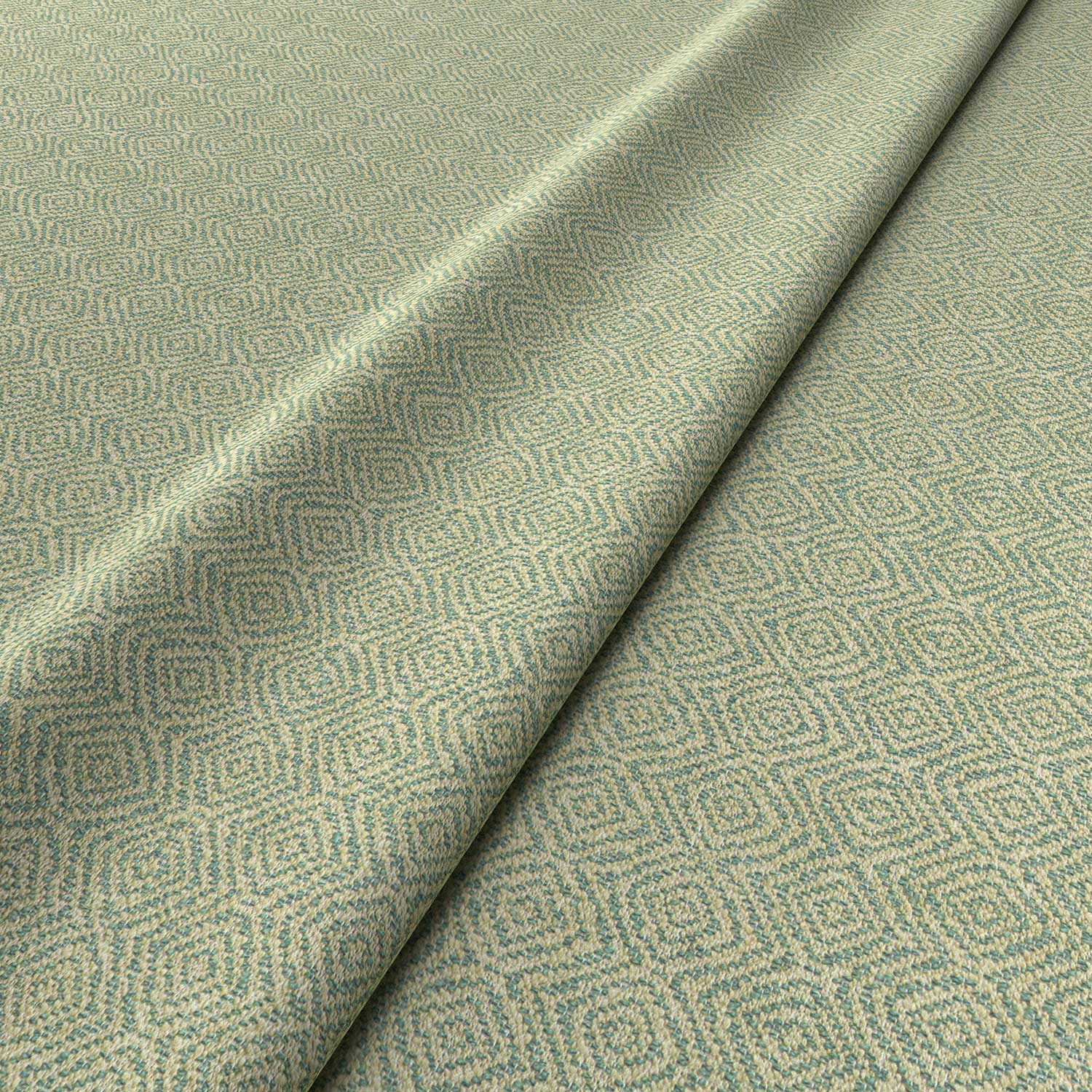 Fabric swatch of a green woven fabric for upholstery