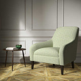 Armchair upholstered in a green woven fabric