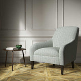 Armchair upholstered in a blue woven fabric