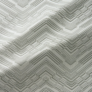 Fabric swatch of a stain resistant herringbone weave design in neutral colours, suitable for curtains and upholstery