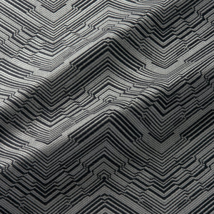 Fabric swatch of a stain resistant herringbone weave design in a black colour, suitable for curtains and upholstery