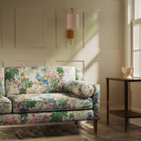 Chair upholstered in a lively, tropical floral and bird linen fabric