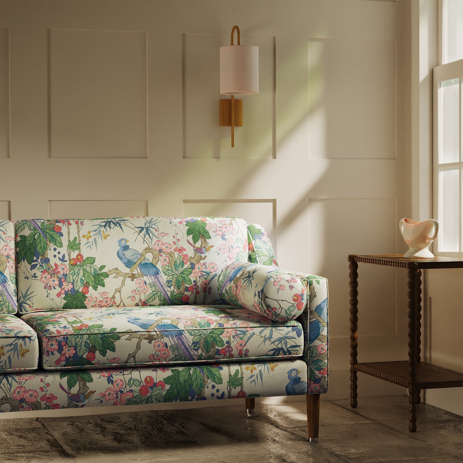 Sofa upholstered in a lively, tropical floral and bird linen fabric