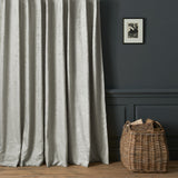 Curtains in a contemporary damask fabric in a cream colour.