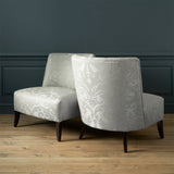 Armchairs in a contemporary damask fabric in a cream colour.