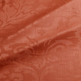 Fabric swatch of a contemporary damask fabric in a red colour for upholstery and curtains.
