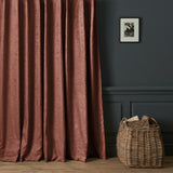 Curtains in a contemporary damask fabric in a deep berry colour.