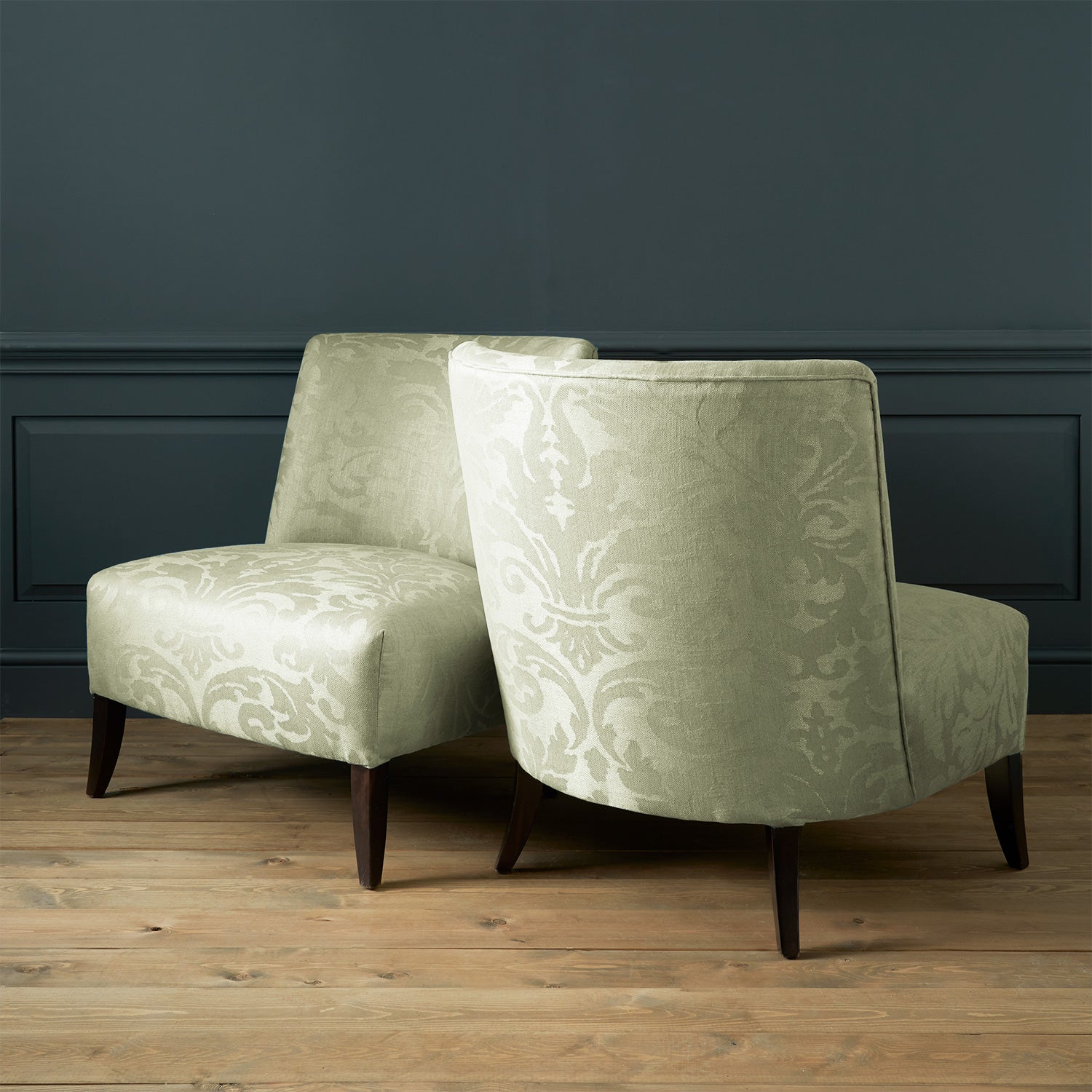 Armchairs in a contemporary damask fabric with light green colours.