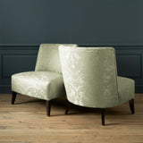 Armchairs in a contemporary damask fabric with light green colours.